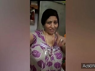 A mature Indian aunt gets naughty with a younger man, indulging in passionate sex after a curry dinner. Their sensual dance leads to intense pleasure.